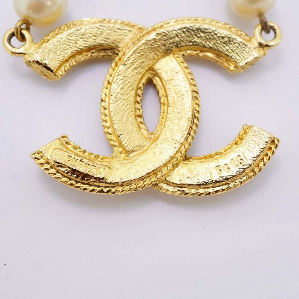 CHANEL Gold Pearl Logo Necklace - Picture 5 of 8